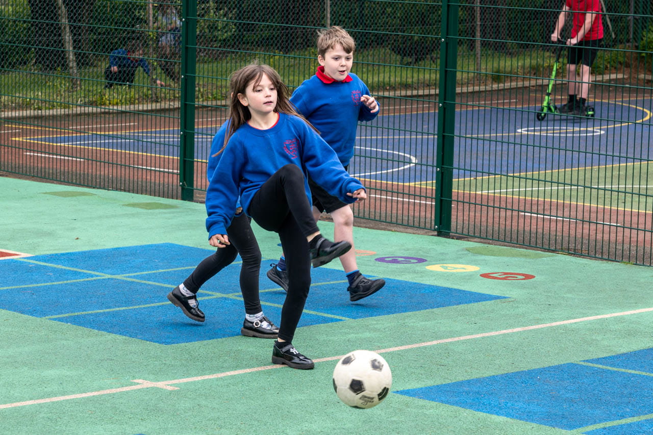 children playing football